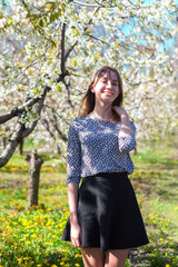 girl in a blooming spring garden