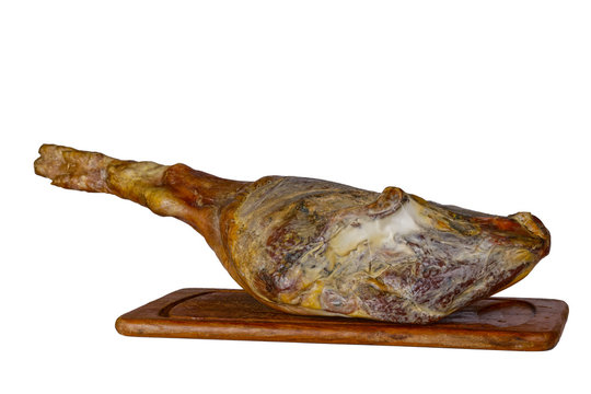 leg of spanish serrano ham isolated on a white background