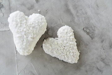 Coconat biscuits arranged in pattern on light textured background, close-up, shallow depth of field, selective focus.