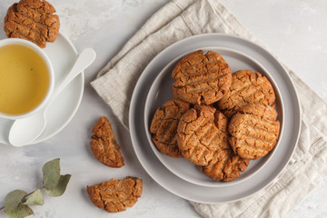 Homemade healthy aquafaba vegan cookies with tea, top view, copy space. Vegetarian food concept.
