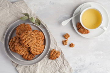 Homemade healthy aquafaba vegan cookies with tea, top view, copy space. Vegetarian food concept.