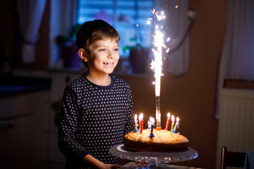 Adorable happy blond little kid boy celebrating his birthday. © Irina Schmidt
