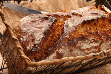 Spelled bread on wooden background