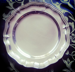 Beautiful shiny silver plate in classical style