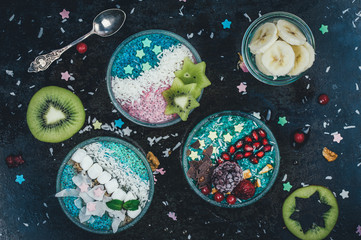 Breakfast smoothie bowls and chia pudding topped with fresh fruits