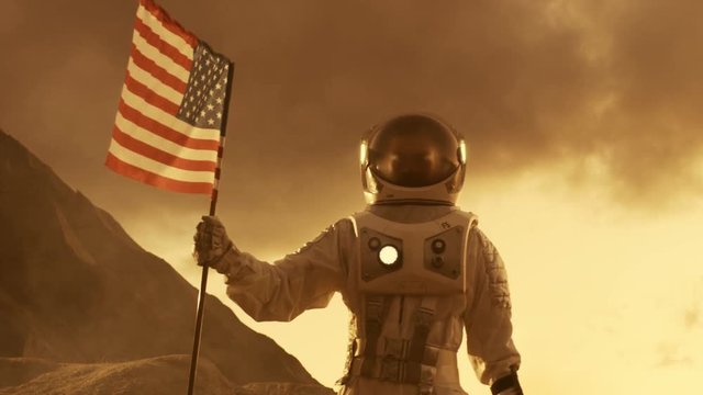 Astronaut Walks on Mars with a Flag of Unites States of America, Proudly Plants it on the Surface of the Red Planet.