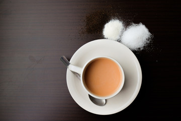 Milk Tea with sugar,creamer and tea leaf on the wooden table.Visible Noise,Blur when view at Full...