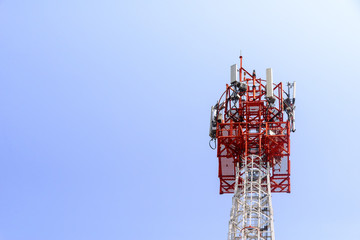 The telecommunication tower in close-up scene with the blue sky.