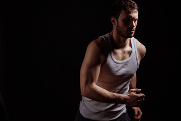 side view shot of young man speeding walking in comfortable clothers.being in a hurry. healthy life.