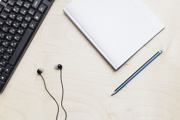 Office table with copybook, computer. View from above