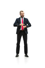 businessman looking at his watch on his hand, watching the time