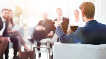 image is blurred.businessman conducting a meeting