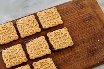Top view close-up picture of tasty cookies on the cutting board, shallow depth of field, selective focus