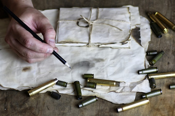 man write letter retro bullet on the table
