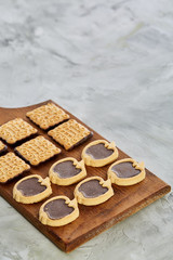 Top view close-up picture of tasty cookies on the cutting board, shallow depth of field, selective focus