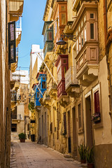 Fototapeta na wymiar Typical beautiful narrow lane in Birgu, Vittoriosa - one of the Three fortified Cities of Malta