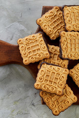 Top view close-up picture of tasty cookies on the cutting board, shallow depth of field, selective focus