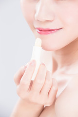 woman use lip balm