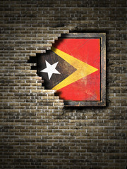Old Timor-Leste flag in brick wall