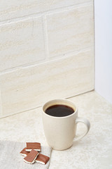 Close-up white cup of coffee with chocolate chip cookies on white background, top view