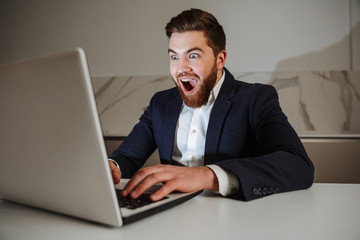 Portrait of an excited young businessman