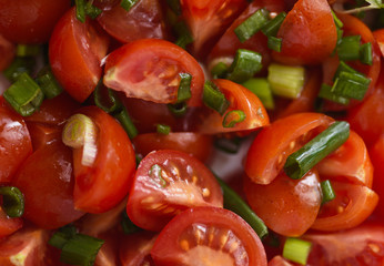 Chopped cherry tomatos and green onion salad, can be used as a backround