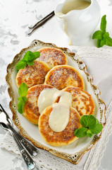 Homemade cottage cheese pancakes with vanilla sauce