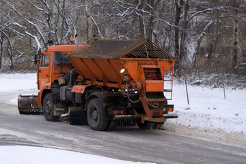 Road cleaning snow-removing machine in the city after huge snowfall .