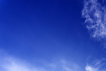Clear sky with clouds , blue background .