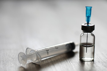 Ampoule and needles from a medical syringe