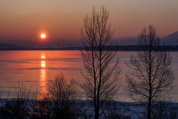 Fototapeta na wymiar Sunrise and reflection on lake