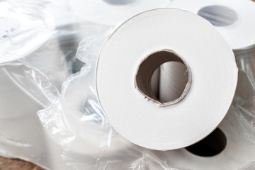Toilet paper on wood background