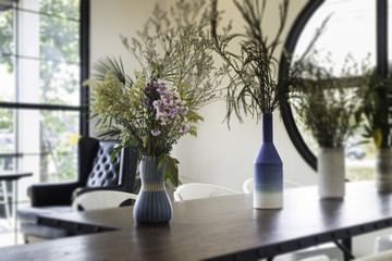 Fototapeta na wymiar Beautiful flower vase decorated on wooden table