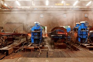 The machine rolled steel in smelting steel plant.