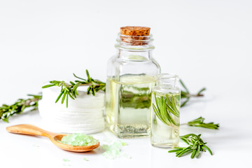 organic cosmetics with extracts of herbs rosemary on white backg