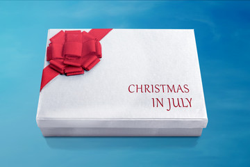White christmas gift box with red ribbon
