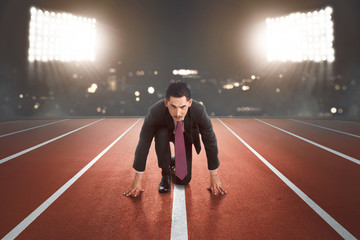 Young asian businessman ready for running