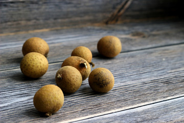 longan on dark wooden background with copy space