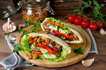 Pita bread sandwiches with meat, beans and vegetables