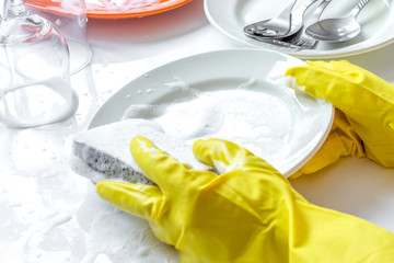 concept of woman washing dishes on white background