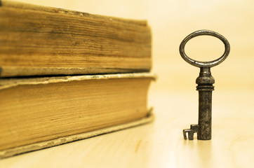 Key and books - life coaching and motivation concept