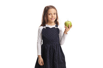 Cute little girl holding an apple and smiling