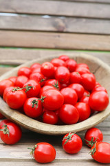 Fresh tomato crop in a wooden bowl © alexkich