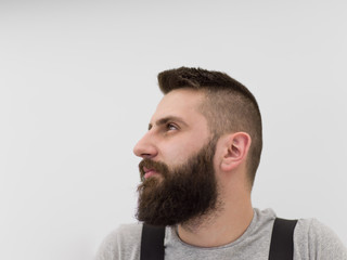 Obraz premium portrait of bearded hipster handyman isolated on white