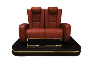 Red executive seat in movie theater with golden lining isolated on white background