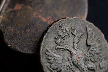 a close-up of the Russian coin of the 18th century, the emblem of the Russian Empire relief