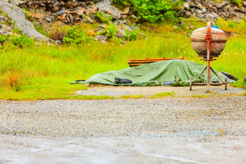Cement mixer on dirt road in green nature surroundings