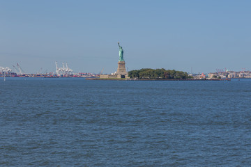 Fototapeta na wymiar Statue of Liberty and panoramic view of Manhattan City skyline.