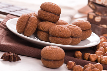 Hazelnut shortbread sandwiches filled with chocolate cream.