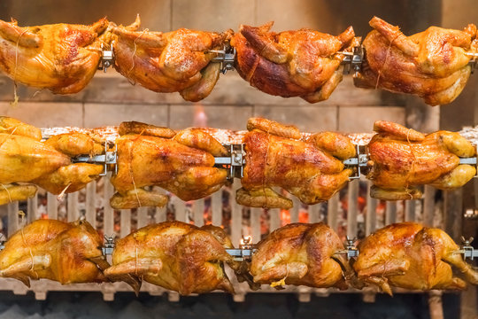 Grilled chickens on a spit, background